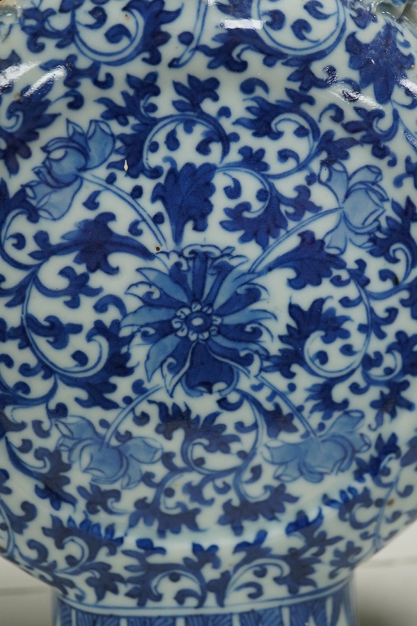 A pair of late 19th century Chinese blue and white moon vases, 23cm. Condition - one vase poor